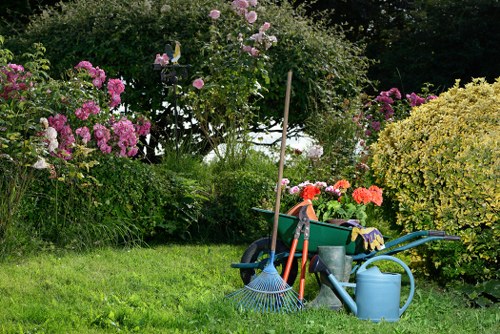 Accessible gardener briefing a client in an Acton garden