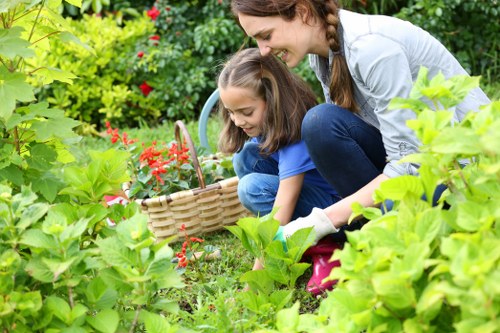Gardening team assessing a terraced garden in Acton